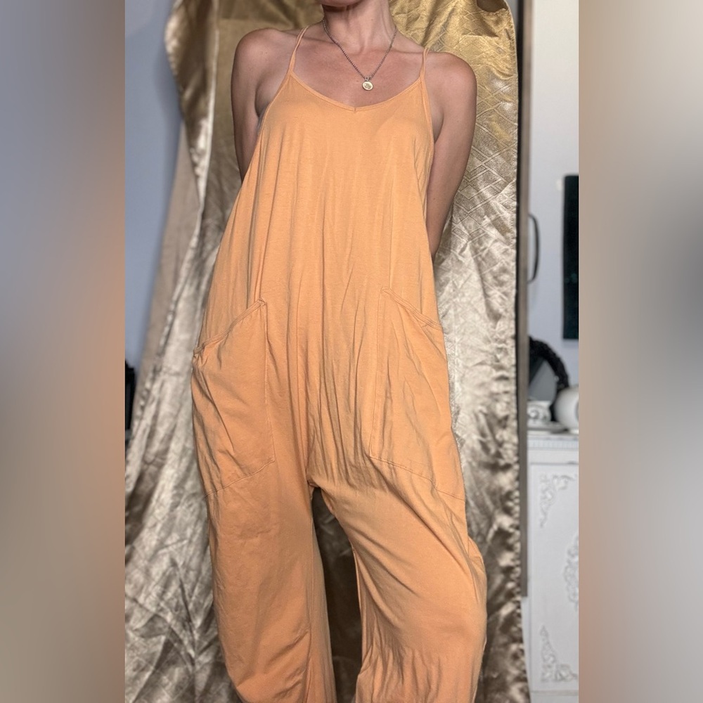 Small loose tangerine jumpsuit pockets